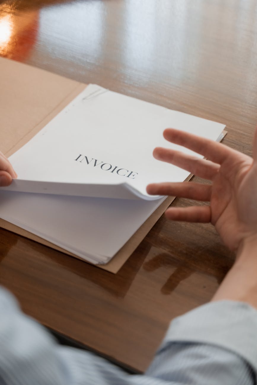 white papers in brown folder